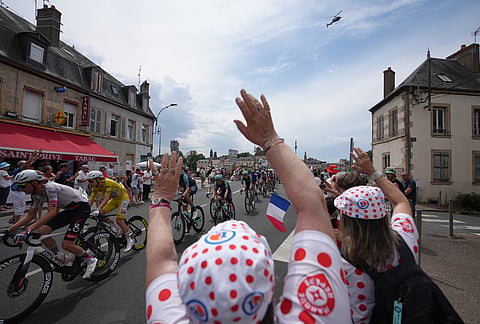 Spectators cheer the riders during the twelfth stage of the Tour de France cycling race with start in Circuit Nevers Magny-Cours and finish in Chalon-sur-Saone, France, Thursday, July 16, 2026. 