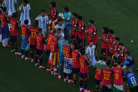 Argentina's Lionel Messi (10) walks through Spanish players during medal ceremony after the World Cup final soccer match between Spain and Argentina in East Rutherford, N.J., near New York, Sunday, July 19, 2026.