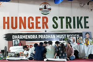 | Photo: PTI/Karma Bhutia : Cockroach Janata Party (CJP) founder Abhijeet Dipke, spokesperson Saurav Das and others sit during their protest demanding Pradhan's resignation over alleged irregularities in the NEET examination, at the Jantar Mantar, in New Delhi, early Sunday, July 19, 2026. Dipke announced an indefinite hunger strike soon after educator and climate activist Sonam Wangchuk, who has been on an indefinite hunger strike for 21 days, was forcibly removed from the Jantar Mantar earlier on Saturday by the Delhi Police and whisked away to Safdarjung Hospital.