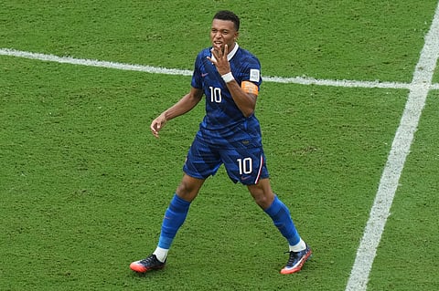 France's Kylian Mbappe (10) celebrates scoring their third goal during the World Cup third-place playoff soccer match between France and England in Miami Gardens
