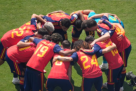 Spain players huddle before the World Cup final soccer match between Spain and Argentina in East Rutherford, N.J., near New York, Sunday, July 19, 2026.