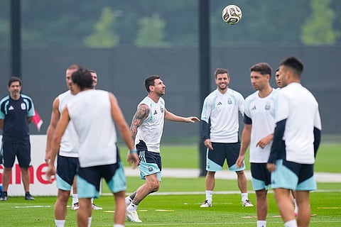 Argentina's Lionel Messi, center, kicks the ball during a training session on the eve of the World Cup final soccer match in Morristown, N.J.