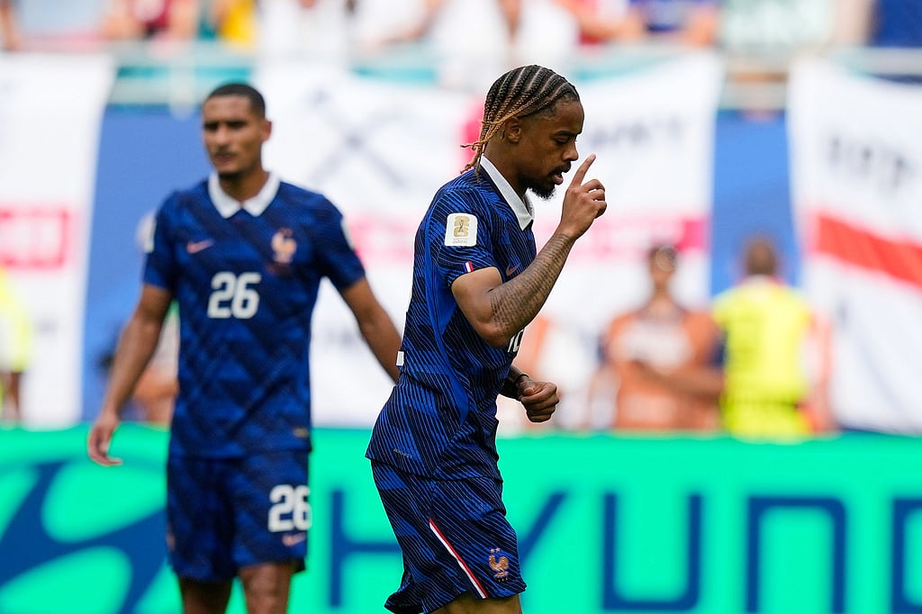 Frances Bradley Barcola, center, celebrates scoring his sides second goal as Maxence Lacroix (26) looks on during the World Cup third-place playoff soccer match between France and England in Miami Gardens