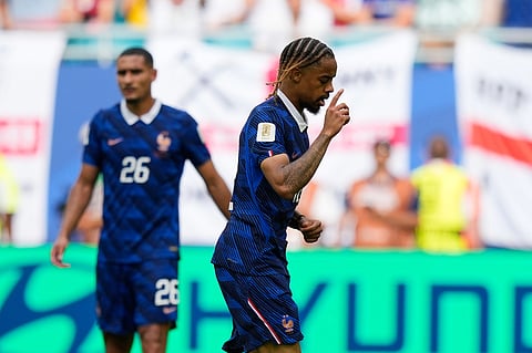 France's Bradley Barcola, center, celebrates scoring his side's second goal as Maxence Lacroix (26) looks on during the World Cup third-place playoff soccer match between France and England in Miami Gardens