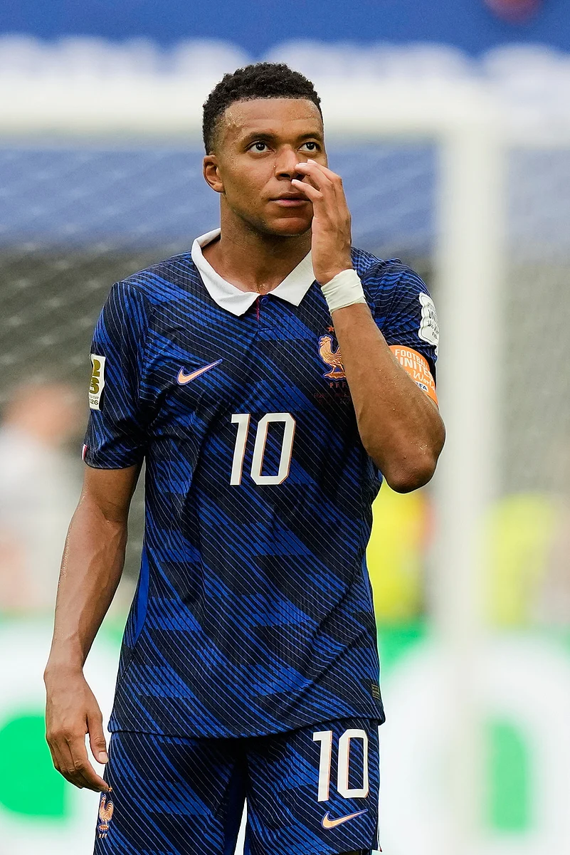 Frances Kylian Mbappe (10) walks off the pitch after the World Cup third-place playoff soccer match between France and England in Miami Gardens