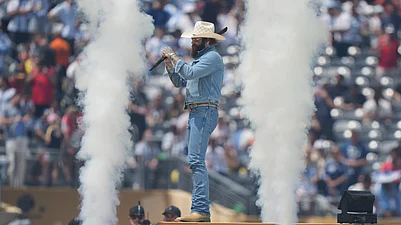 (AP Photo/Stephanie Scarbrough) : Post Malone performs prior to the World Cup final soccer match between Spain and Argentina in East Rutherford, N.J., near New York, Sunday, July 19, 2026.