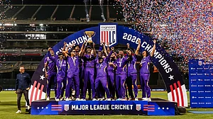 X/MLCricket : Los Angeles Knight Riders players celebrate with the MLC 2026 championship trophy amid fireworks and confetti after their dramatic one-run victory over Washington Freedom at the Oakland Coliseum