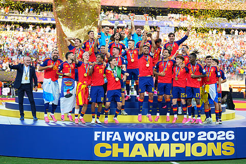 Spain celebrates with the trophy after the World Cup final soccer match between Spain and Argentina in East Rutherford, N.J., near New York, Sunday, July 19, 2026.