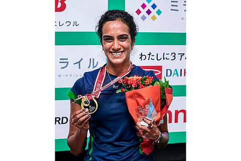 In this image posted on July 19, 2026, Defense Minister Rajnath Singh, unseen, congratulates PV Sindhu after she clinched her maiden Super 750 title at the Japan Open. 