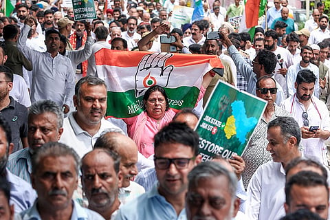 Congress leaders and workers stage a protest march towards the Lok Bhavan to submit a memorandum addressed to President Droupadi Murmu in support of the demand for immediate restoration of full statehood to Jammu and Kashmir, in Jammu.