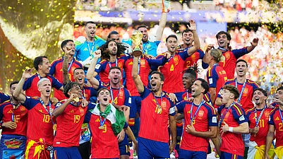 (AP Photo/Julio Cortez) : Spain celebrates with the trophy after the World Cup final soccer match between Spain and Argentina in East Rutherford, N.J., near New York, Sunday, July 19, 2026.