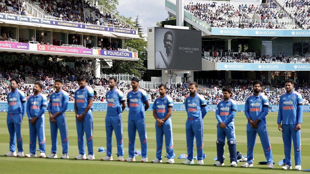 India players stand for a minute of silence in tribute to late cricketer Sir Garfield Sobers before the start of the third ODI against England at Lord's, London on Sunday, July 19, 2026. - AP Photo/Steven Paston