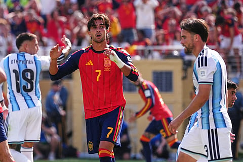 Spain's Ferran Torres (7) reacts after taking a shot as Argentina's Nicolas Tagliafico (3) walks past during the World Cup final soccer match between Spain and Argentina in East Rutherford, N.J., near New York, Sunday, July 19, 2026.