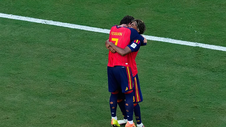 Spain's Ferran Torres (7) celebrates scoring their first goal with Spain's Lamine Yamal during the World Cup final soccer match between Spain and Argentina in East Rutherford, N.J., near New York, Sunday, July 19, 2026. - (AP Photo/Yuki Iwamura)