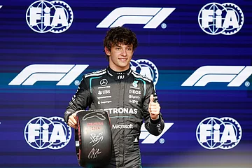 | Photo: AP/Geert Vanden Wijngaert : Mercedes driver Andrea Kimi Antonelli of Italy celebrates on the podium after clocking the fastest time during the qualifying session ahead of the Formula One Grand Prix at the Spa-Francorchamps racetrack in Spa, Belgium.