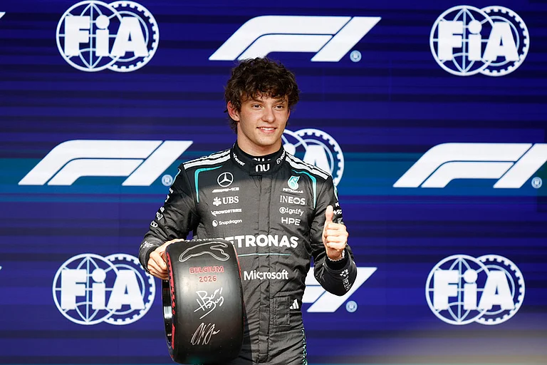 Mercedes driver Andrea Kimi Antonelli of Italy celebrates on the podium after clocking the fastest time during the qualifying session ahead of the Formula One Grand Prix at the Spa-Francorchamps racetrack in Spa, Belgium. - | Photo: AP/Geert Vanden Wijngaert