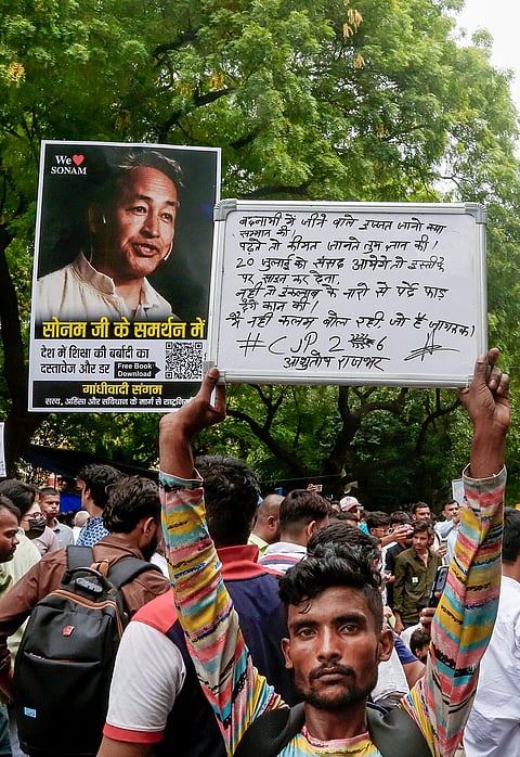 Cockroach Janata Party (CJP) supporters during a protest demanding Union Education Minister Dharmendra Pradhan's resignation over alleged irregularities in the NEET examination, at the Jantar Mantar in New Delhi.