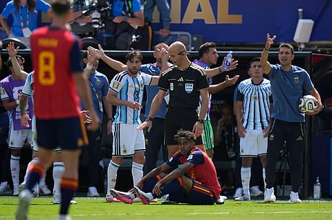 Spain's Lamine Yamal (19) sits on the ground during the World Cup final soccer match between Spain and Argentina in East Rutherford, N.J., near New York, Sunday, July 19, 2026.