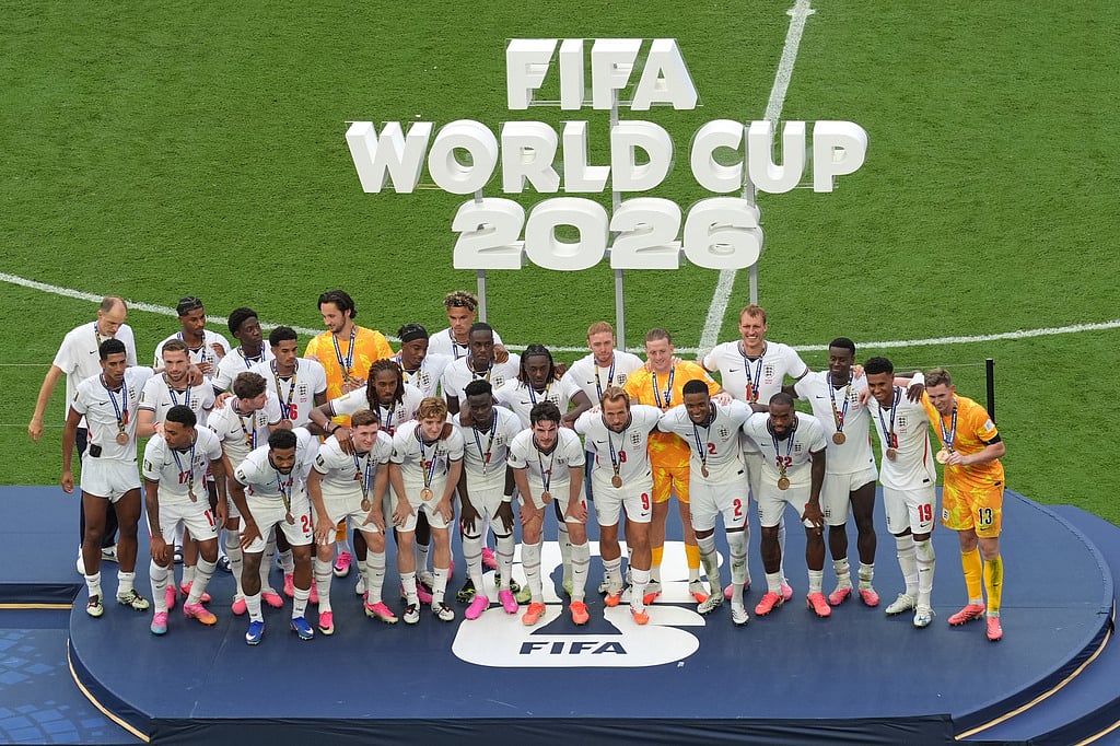 England poses with their medals after winning the World Cup third-place playoff soccer match between France and England in Miami Gardens
