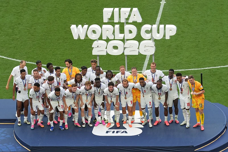 England poses with their medals after winning the World Cup third-place playoff soccer match between France and England in Miami Gardens
