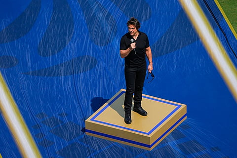 Actor Tom Cruise speaks prior to the World Cup final soccer match between Spain and Argentina in East Rutherford, N.J., near New York, Sunday, July 19, 2026.