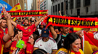 (AP Photo/Yuki Iwamura) : Spain fans gather for a rally on the eve of the World Cup final soccer match in New York's Times Square, Saturday, July 18, 2026.