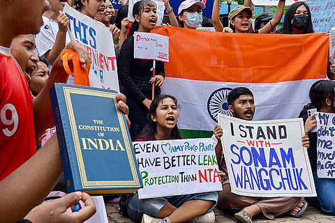 Students from different institutions and schools stage a protest in support of activist Sonam Wangchuk and the Cockroach Janta Party's protest at Delhi's Jantar Mantar, demanding Union Education Minister Dharmendra Pradhan’s resignation, in Agartala.