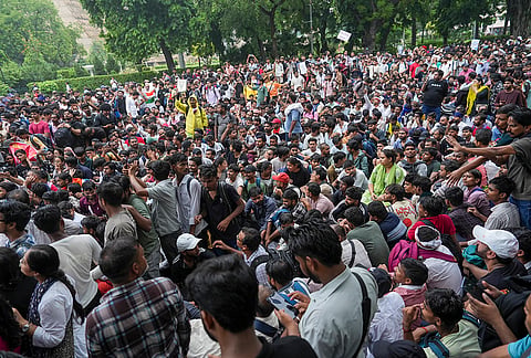 Cockroach Janata Party (CJP) supporters raise slogans, near Jantar Mantar ahead of a protest march, in New Delhi, early Monday, July 20, 2026. 
