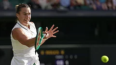 Aryna Sabalenka of Belarus returns the ball to Naomi Osaka of Japan in their fourth round women's singles match at the Wimbledon Tennis Championships in London, Sunday, July 5, 2026. - | Photo: AP/Brian Inganga