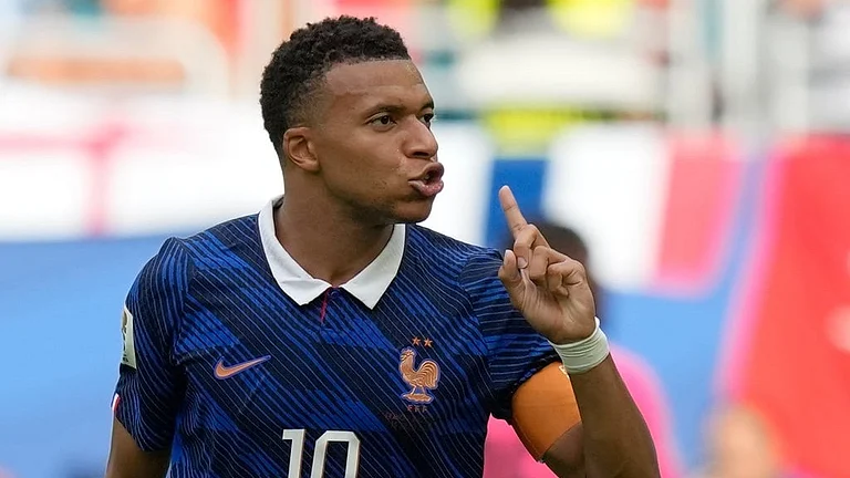 France's Kylian Mbappe (10) reacts after scoring his side's third goal during the World Cup third-place playoff soccer match between France and England in Miami Gardens - Rebecca Blackwell/AP Photo