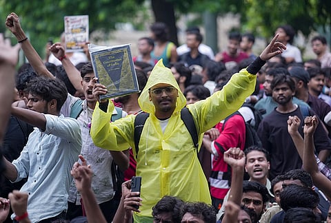 Cockroach Janata Party (CJP) supporters raise slogans, near Jantar Mantar ahead of a protest march, in New Delhi, early Monday, July 20, 2026.