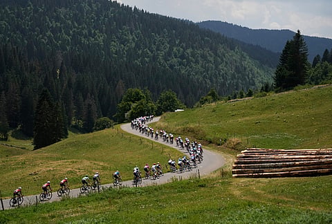 The pack rides during the fifteenth stage of the Tour de France cycling race, from Champagnole to Plateau de Solaison, France, Sunday, July 19, 2026. 