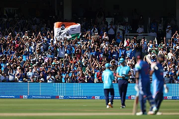 | Photo: Steven Paston/PA via AP : India fans celebrate in the stands after Rohit Sharma reaches his century during the third ODI between England and India, at Lord's cricket ground, London.