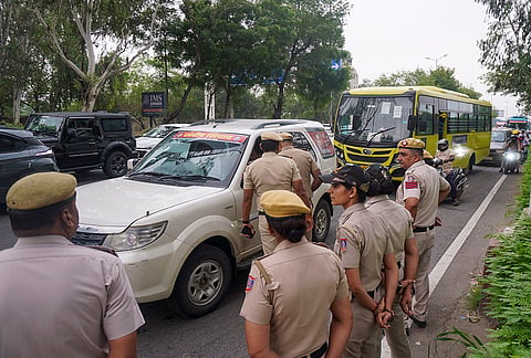 Police personnel inspect a vehicle at Ring road near Nizamuddin bridge ahead of a protest march by Cockroach Janata Party supporters, in New Delhi, Monday, July 20, 2026. 