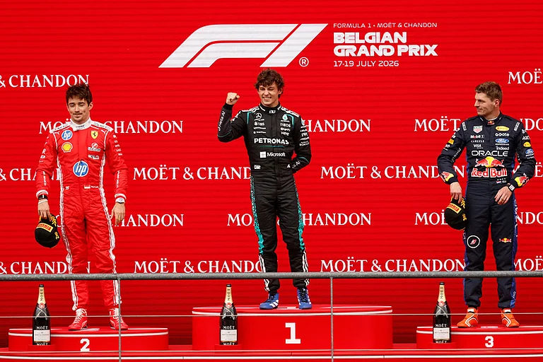 Mercedes driver Andrea Kimi Antonelli of Italy, center, stands on the podium with Ferrari driver Charles Leclerc of Monaco, left, and third place Red Bull driver Max Verstappen of the Netherlands, after winning the Formula One Grand Prix at the Spa-Francorchamps racetrack in Spa, Belgium. - | Photo: AP/Geert Vanden Wijngaert