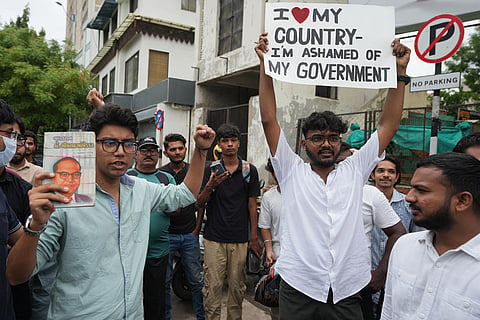 Protesters shouts slogans during a protest in solidarity with activist Sonam Wangchuk's hunger strike and calling for the resignation of the education minister, in Ahmedabad, India.