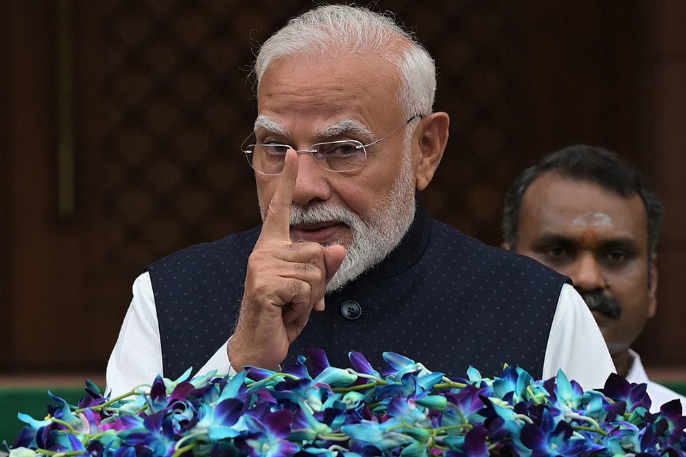 Indian Prime Minister Narendra Modi addresses the media outside Parliament House on the opening day of the monsoon session, in New Delhi, India. - | Photo: AP/Sanjeev Rastogi
