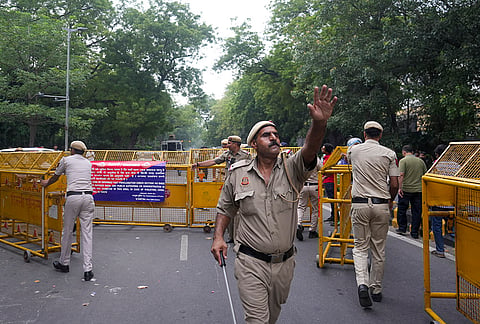 Police personnel block a road with barricades, ahead of the Cockroach Janata Party's (CJP) protest march, at the Jantar Mantar, in New Delhi, early Monday, July 20, 2026. Before CJP's proposed march to Parliament on Monday to press for education reforms, political leaders, actors and common people thronged the protest site, even as authorities put in place elaborate security arrangements and said that no permission had been sought for any such procession. 
