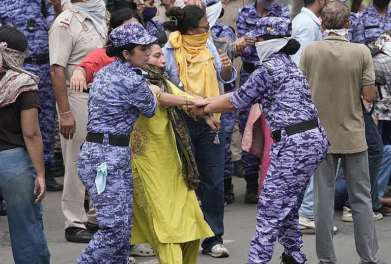 Security personnel stop Cockroach Janata Party (CJP) supporters during a protest march, near the Parliament in New Delhi - Tribhuvan Tiwari/Outlook
