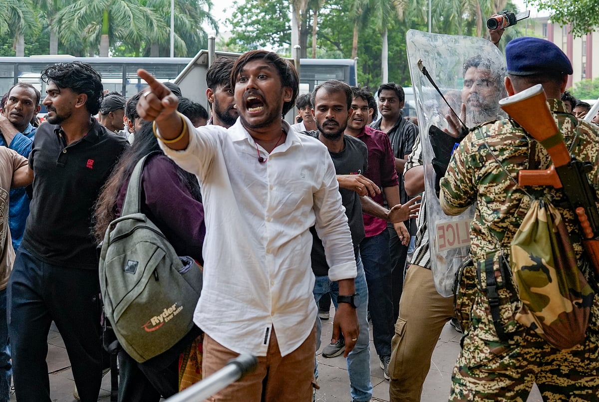 Cockroach Janata Party (CJP) supporters raise slogans during a protest march, at Patel Chowk, in New Delhi, Monday, July 20, 2026. Delhi Police is on high alert ahead of the Monsoon Session of Parliament and CJP's proposed "Chalo Sansad" march on Monday.  - Money Sharma