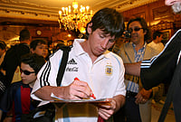 Messi Mania: ARG Star Registers Unique Record Alongside CR7 | Photo: AP/Francesco Pecoraro, File : Argentina's Lionel Messi signs autographs upon his team's arrival to their hotel in Sant'Antonio Abate, near Naples, southern Italy, May 29, 2006, ahead of their pre-World Cup friendly match with Angola.