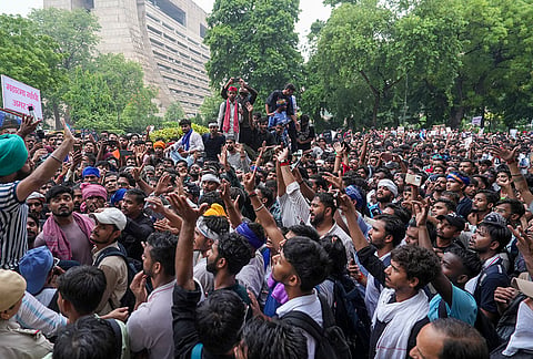 Cockroach Janata Party (CJP) supporters raise slogans, near Jantar Mantar ahead of a protest march, in New Delhi, early Monday, July 20, 2026.