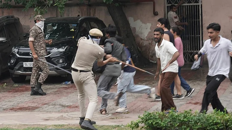 Security personnel stop Cockroach Janata Party (CJP) supporters as they raise slogans during a protest march, at Sansad Marg, in New Delhi, Monday, July 20, 2026. - | Photo: Tribhuvan Tiwari/Outlook