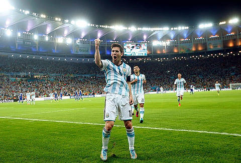 Argentina's Lionel Messi celebrates scoring his side's second goal against Bosnia during the group F World Cup soccer match at Maracana Stadium in Rio de Janeiro, Brazil, June 15, 2014. 