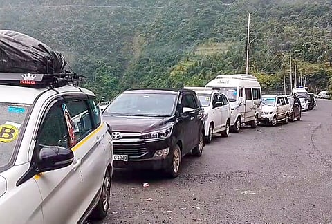 Vehicles halted at Chanderkoot Yatri Niwas after Amarnath Yatra was temporarily suspended from both the Pahalgam and Baltal routes in view of the Meteorological department's forecast of widespread rainfall over the next few days, in Ramban, Jammu and Kashmir, Sunday, July 19, 2026. 