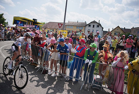 France's Paul Seixas, wearing the best young rider's white jersey, arrives for the start of the fifteenth stage of the Tour de France cycling race, from Champagnole to Plateau de Solaison, France, Sunday, July 19, 2026.  