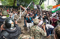 'No Protester Under Detention,' Says Delhi Police; CJP Calls Off Protest Outside PHQ | Photo: PTI/Karma Bhutia : Police personnel stop Cockroach Janata Party (CJP) supporters during a protest march, near the Jantar Mantar, at Sansad Marg, in New Delhi.