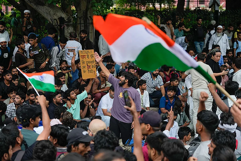 Cockroach Janata Party (CJP) supporters raise slogans as they gather ahead of a protest march, at the Jantar Mantar, in New Delhi, early Monday, July 20, 2026. Delhi Police is on high alert ahead of the Monsoon Session of Parliament and CJP's proposed "Chalo Sansad" march on Monday, with heavy deployment of personnel visible at every nook and corner around Jantar Mantar, Parliament and other key locations. - Photo: PTI/Salman Ali