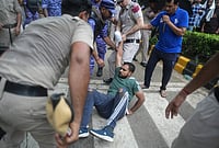 | Photo: PTI/Karma Bhutia : Police and security personnel remove Cockroach Janata Party (CJP) supporters ahead of a protest march, near the Jantar Mantar at Sansad Marg, in New Delhi, Monday, July 20, 2026. 