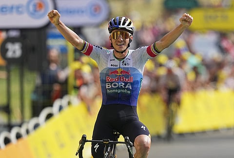 Belgium's Remco Evenepoel celebrates as he crosses the finish line to win the fifteenth stage of the Tour de France cycling race, from Champagnole to the Plateau de Solaison, France, Sunday, July 19, 2026.